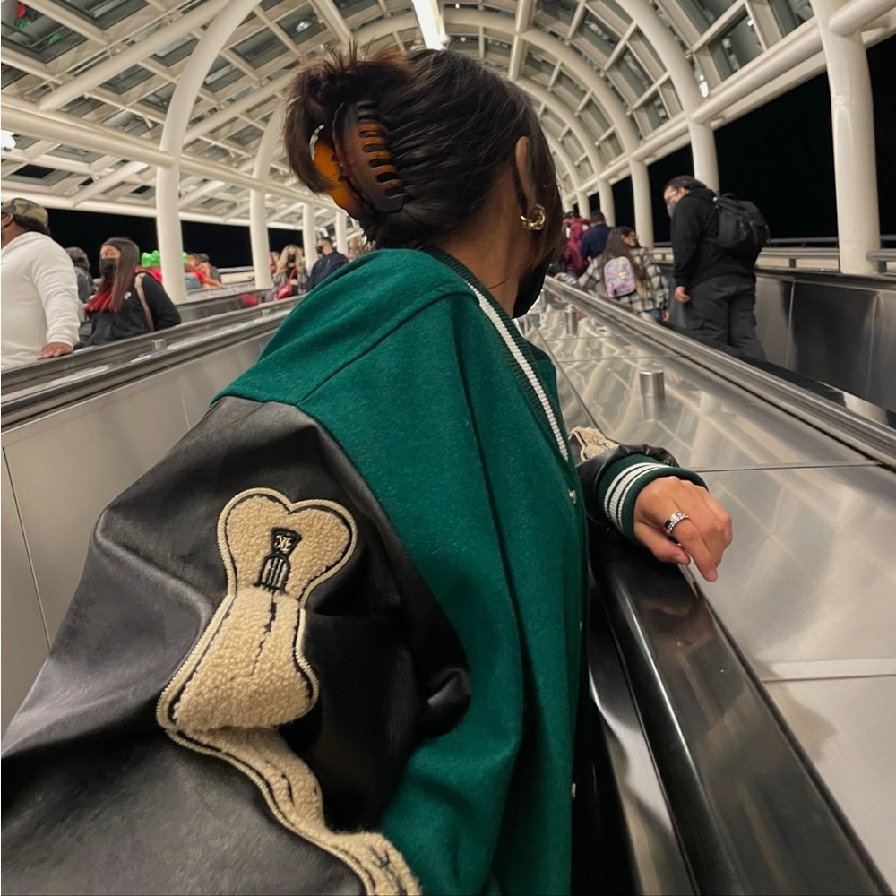 Green and black varsity jacket
